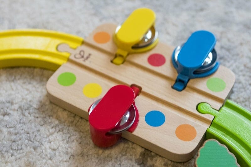 The tambourine track section from the Hape Rainbow Puzzle Wooden Train set
