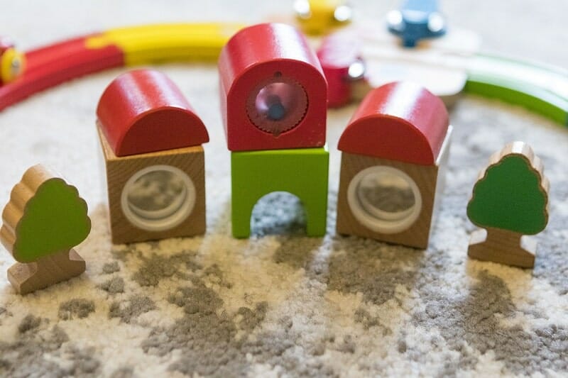The bricks which make up the station and trees with the Rainbow Puzzle Wooden Train Set from Hape