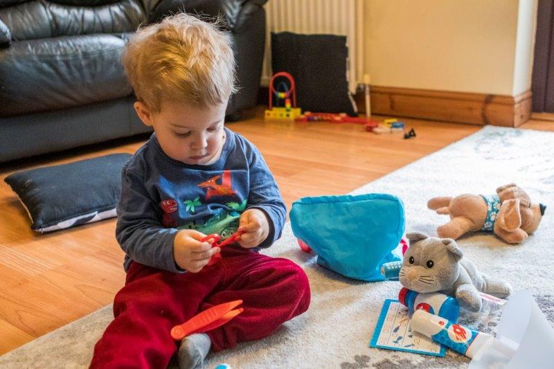 Rex playing with the Melissa and Doug Pet Vet Play Set