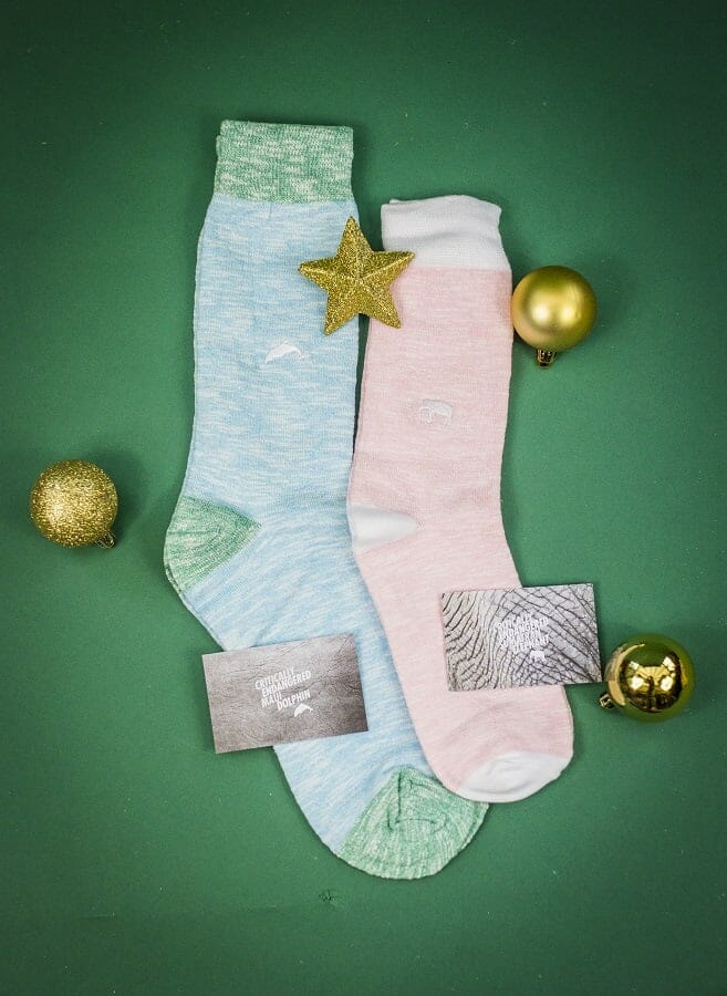 Socks featuring a dolphin and an elephant from Critically Endangered socks included in the clutter-free gift guide