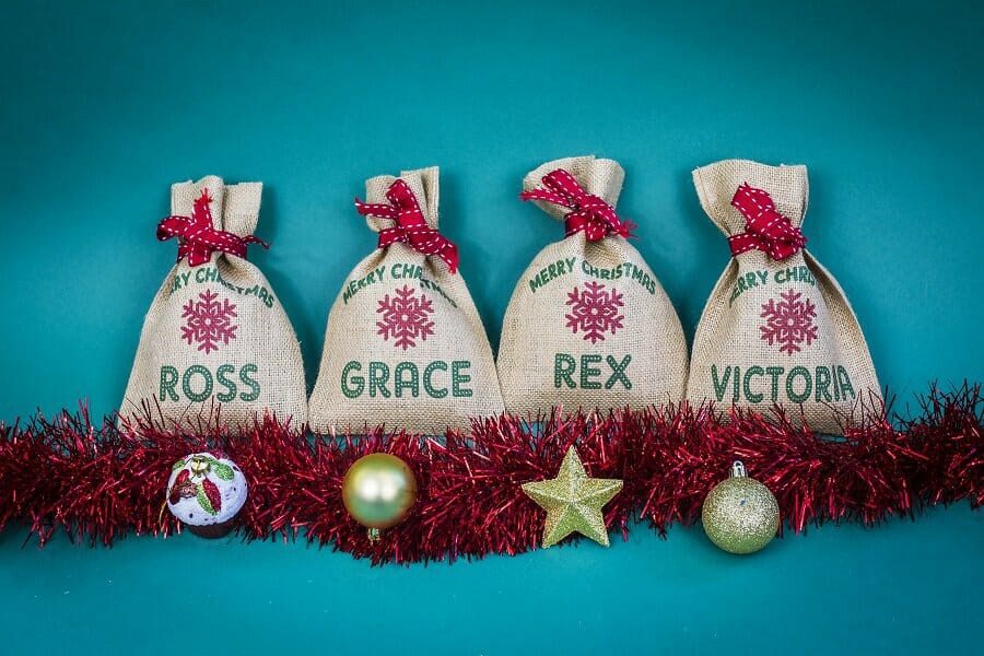 Harrow and Green Mini Snowflake sacks featuring the names Victoria,, Ross, Grace and Rex included in the clutter-free gift guide