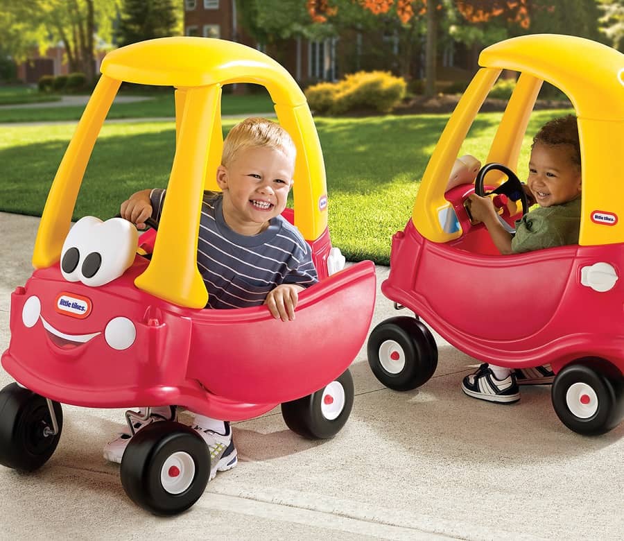 Two little boys playing in Little Tikes Little Coupe cars