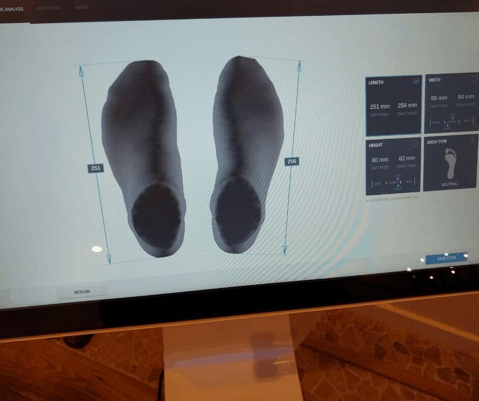 A shot of a pair of feet having been measured by the Hotter Shoes Hotter Footprint machine