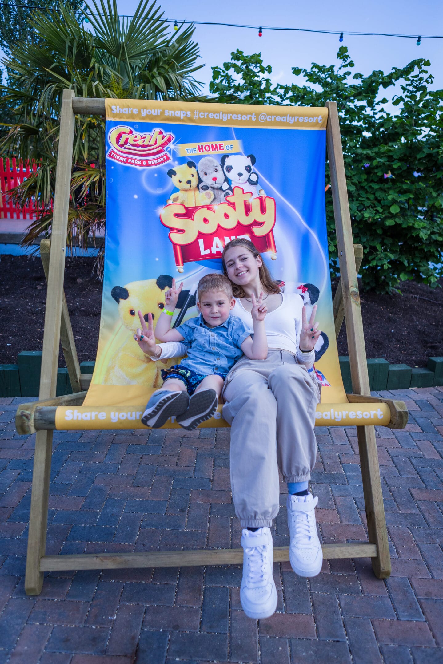 Two children on the branded deck chair at Sooty Land in Crealy Theme Park