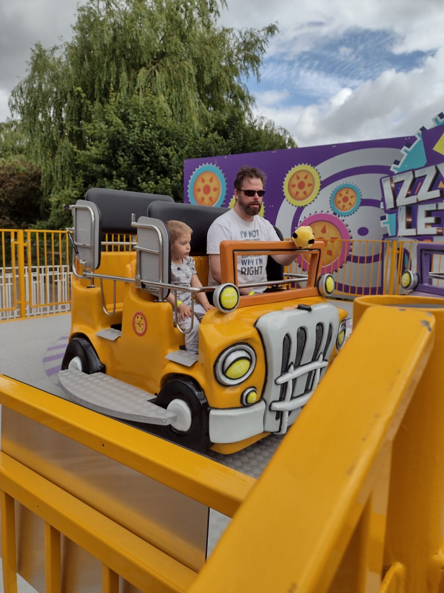 A father and son on the Izzy Whizzy Let's Get Dizzy Ride at Sooty Land